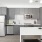 kitchen with grey cabinets and stainless steel appliances