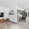 living room with tv and kitchen