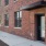 brick building with a side walk