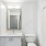 bathroom with mirror and toilet